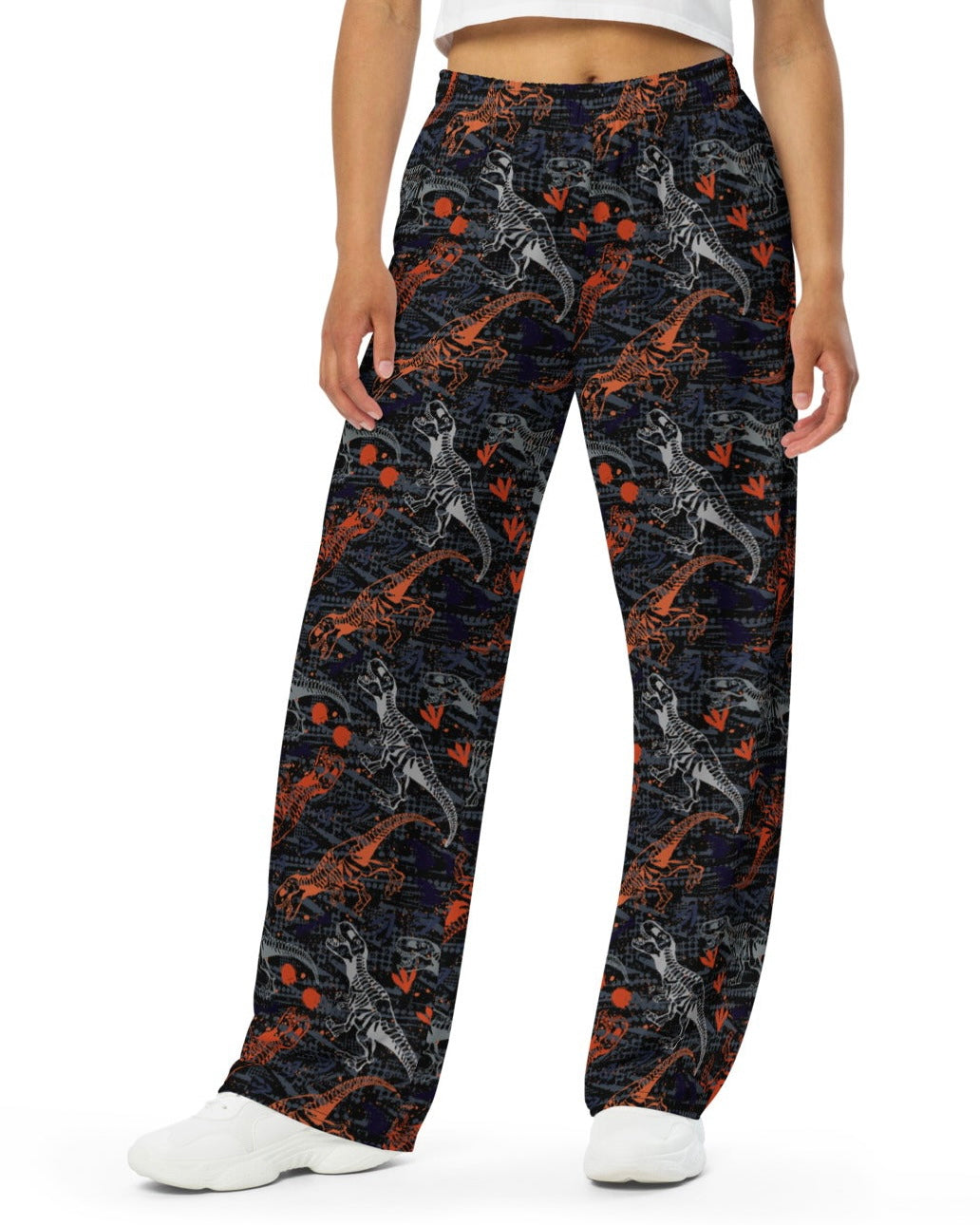 Front view of model rocking One Stop Rave's T-Wrecked Wide Leg Pants with a distinct dinosaur print.