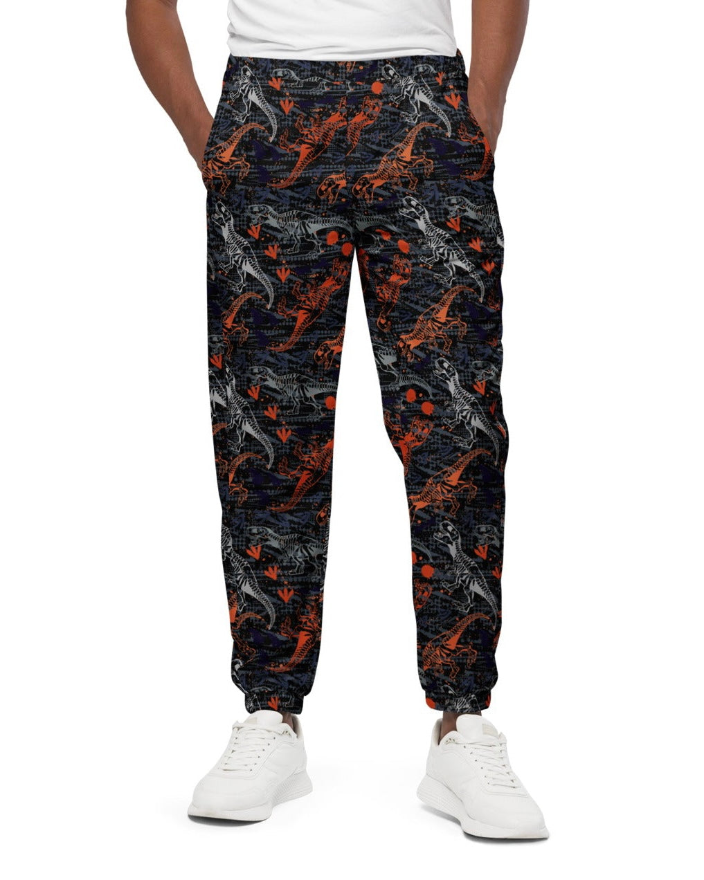 Front view of model wearing One Stop Rave's T-Wrecked Unisex Track Pants, showing off the dynamic dinosaur print.