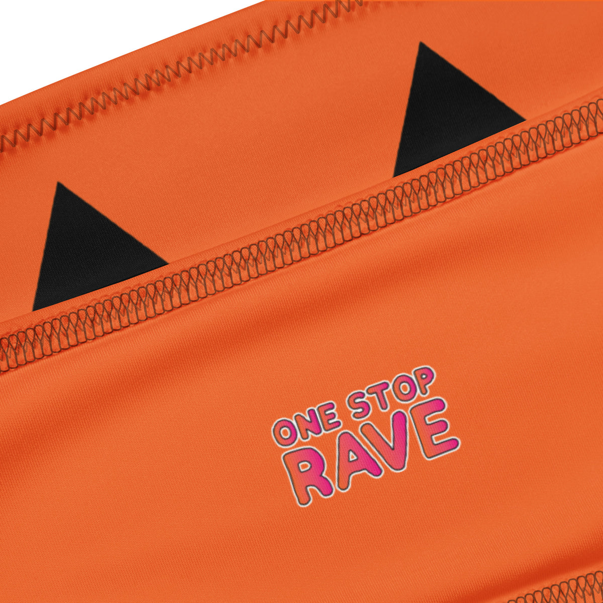 Close-up of the pumpkin design, stitching, and fabric on the Jack bandeau top