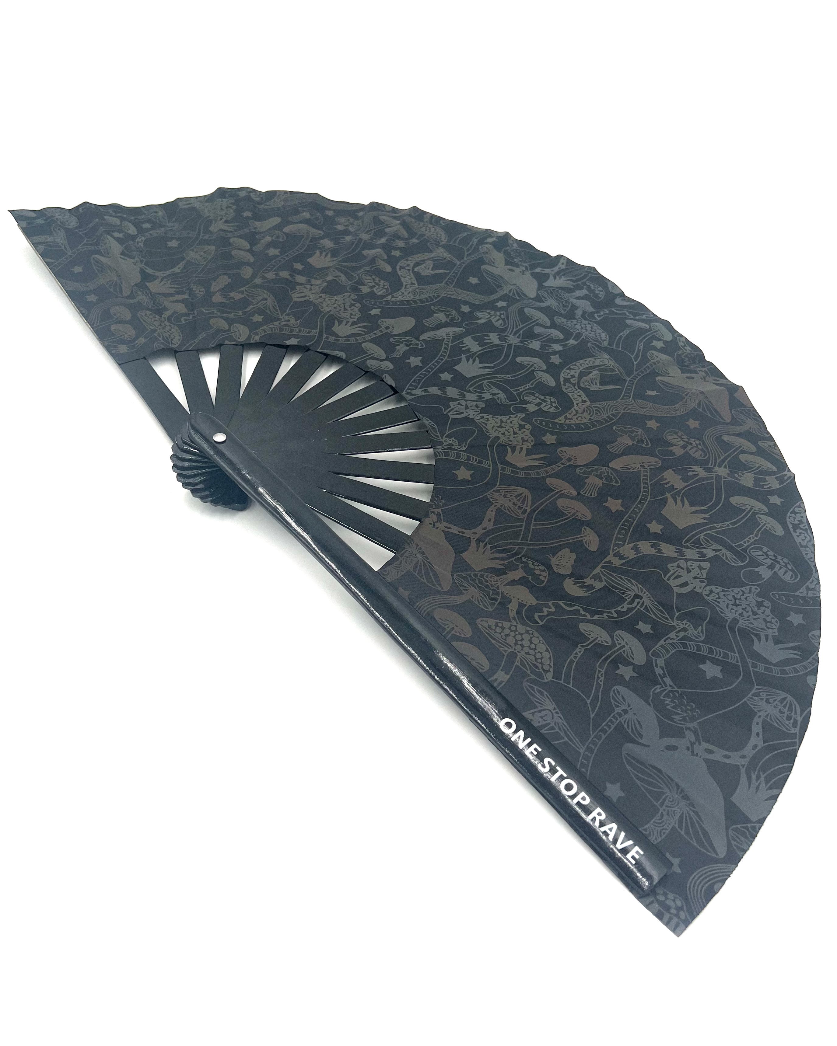 Angled view of the Magic Mushroom Reflective Festival Hand Fan.