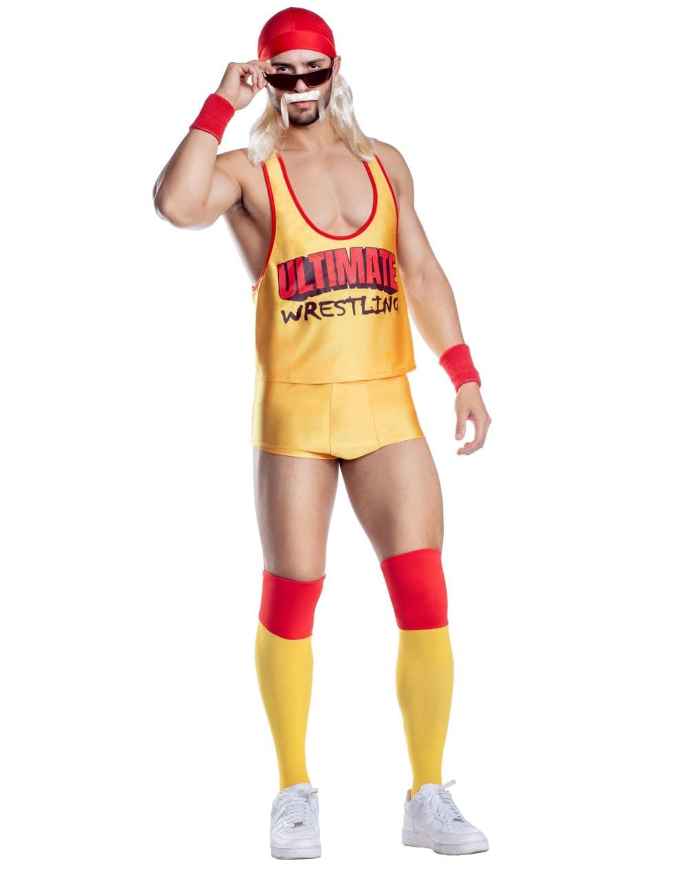 A man modeling a wrestling costume set against a plain white background. The set includes a yellow and red singlet with 'ULTIMATE WRESTLING' printed on the chest, matching yellow and red shorts, red wristbands, red knee bands, a red headband, and black sunglasses.