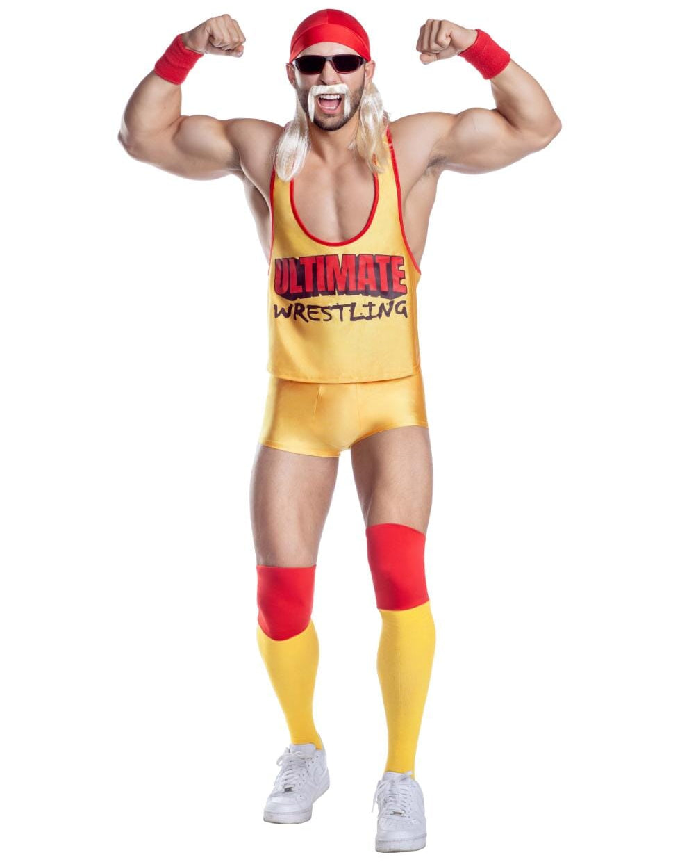 A man modeling a yellow and red wrestling costume consisting of a tank top, matching shorts, knee pads, arm bands, and a red headband, posed against a plain white background.